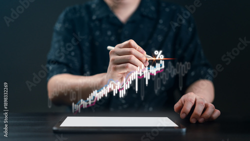Businessman using a pen to analyze a glowing financial candlestick chart with a percentage icon on a tablet. Concept of stock market trading, technical analysis, and digital investment profit.