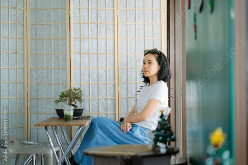 Portrait of asian woman drinking green tea at cafe