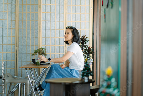 Portrait of asian woman drinking green tea at cafe
