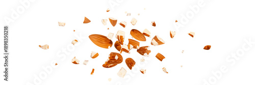 Crushed almonds falling isolated, flying nut pieces, levitate scattered almond seeds