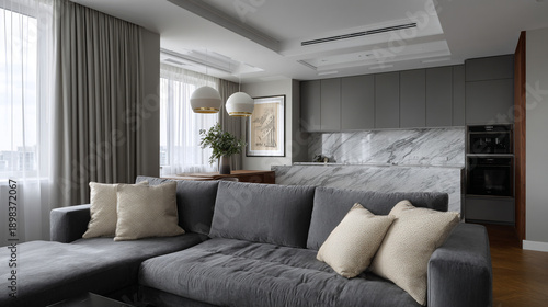 Modern studio living room with gray kitchen.