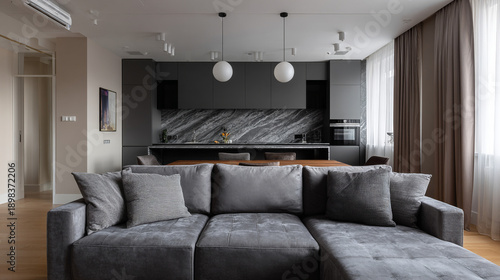 Modern studio living room with gray kitchen.