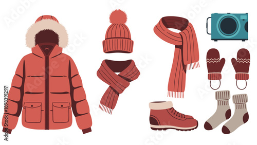 Collection of warm winter apparel including a red parka, hat, scarves, gloves, boots, and socks with a camera for travel themes.