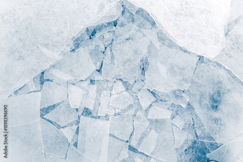 Shards of crushed thin ice in a light-blue tone. Background texture.