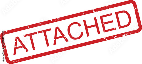 Red rubber stamp with the word ATTACHED clearly printed in capital letters on a white surface