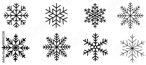 Collection of seven unique black snowflakes on a pure for winter designs