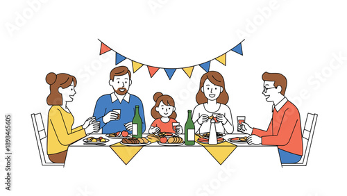 Happy family with a child having dinner at a decorated table with wine, food, and festive flags in a warm home interior.