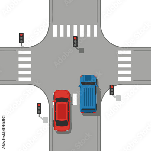 Top view of intersection with red and blue cars, traffic lights and pedestrian crossing