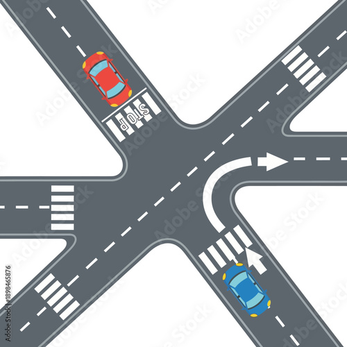Top-down view of a busy road intersection with cars navigating traffic rules.