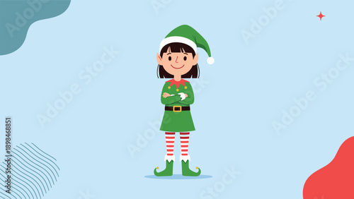 Young girl dressed in a green and red elf costume with striped tights and a pointed hat standing confidently with her arms crossed.