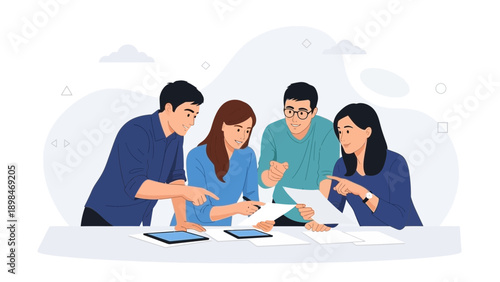 Diverse team collaborating on project, discussing documents and tablets at desk