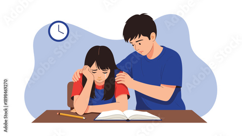 Supportive older brother placing his hand on his sad sister's shoulder to comfort her while she studies at a desk late at night.