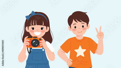 Smiling young girl holds an orange camera while standing next to her boy friend who is giving a peace sign gesture.
