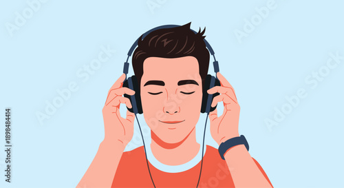 Young man with his eyes closed, enjoying listening to music peacefully through a large pair of modern headphones.