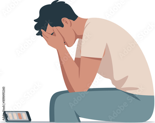 Person covering face with hands next to phone sitting