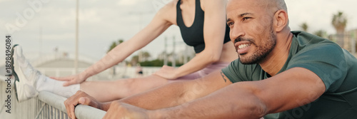 Wallpaper Mural Side view of multi-ethnic couple of fit people training together in summer on the seafront. Couple goals and sports motivation, active lifestyle. Teamwork in sport. Panoramic. Panoramic Torontodigital.ca