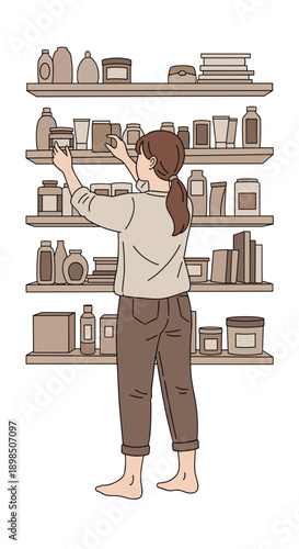 Woman arranging household items on shelves at home