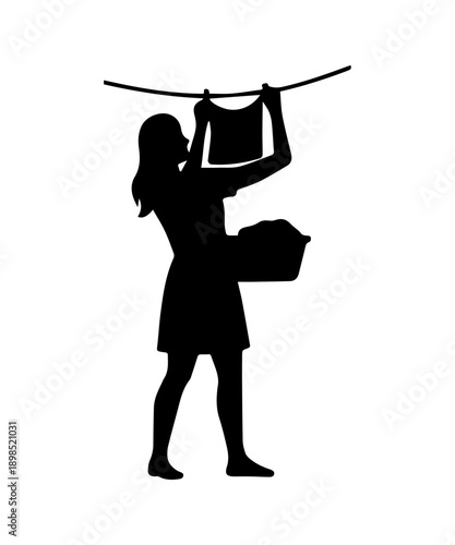 Woman silhouette hanging wet clothes on a line for drying, performing household chores