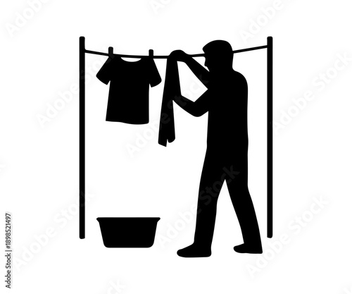 Man hanging laundry on a clothesline