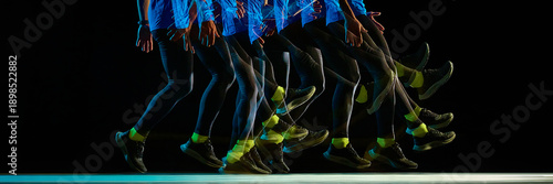 Fotografie Stroboscopic runner stride sequence on black background