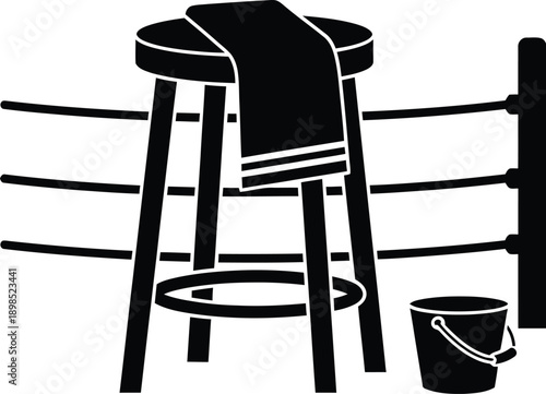Corner of a boxing ring, with a stool, towel, and a bucket.