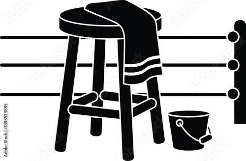 Corner of a boxing ring, with a stool, towel, and a bucket.