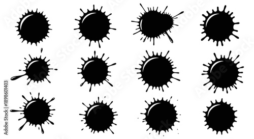 Set of black ink splashes and splatters on a white background.