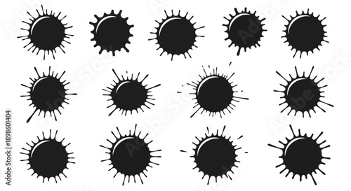 Collection of black ink splatters and paint blots.