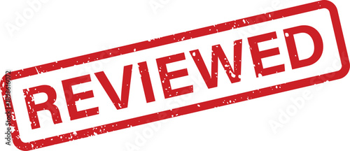 A distinct red rubber stamp displays the word REVIEWED with a rough distressed texture on a clean white surface