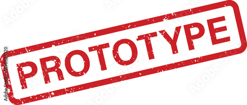 A distinctive red rubber stamp displaying the word PROTOTYPE inside a rectangular border on a pristine white surface