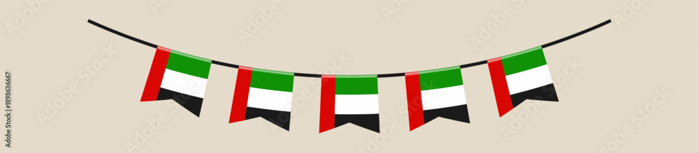 Fototapeta premium United Arab Emirates flag bunting hanging in a garland for a patriotic National Day celebration decorative element.