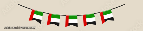 United Arab Emirates flag bunting hanging in a garland for a patriotic National Day celebration decorative element.
