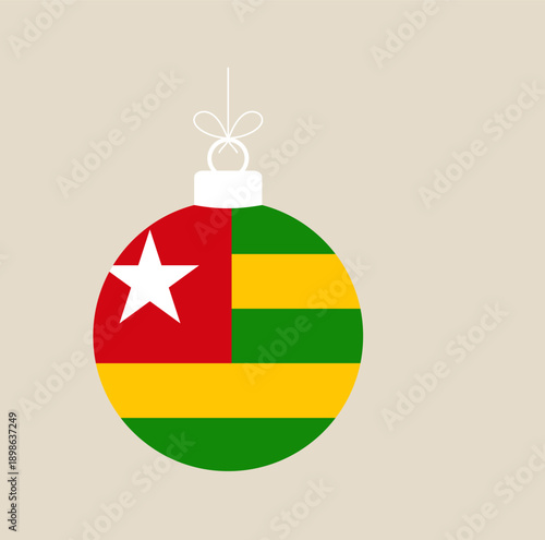Togolese flag Christmas ball ornament hanging as a festive national holiday decoration for the winter season.