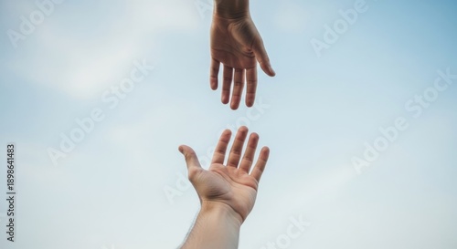 Reaching Hands Helping Each Other Against Blue Sky Background