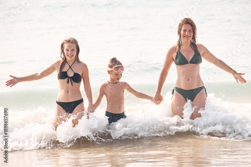 two young girls playing on the beach