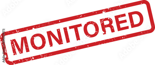 A grunge style red rubber stamp with the word MONITORED prominently displayed on a clean white surface