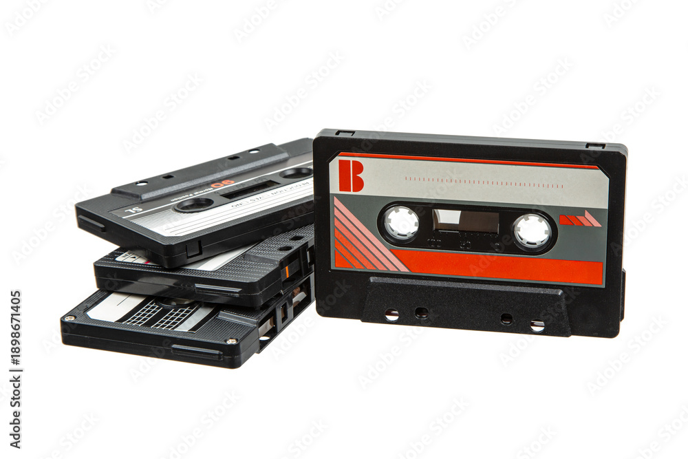 Fototapeta premium Stack of vintage audio cassette tapes isolated on a white back