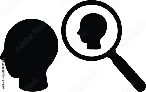 Black silhouette of a human head with a magnifying glass focusing on a profile