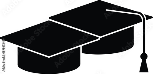 Two black graduation caps are stacked representing academic achievement and completion high quality
