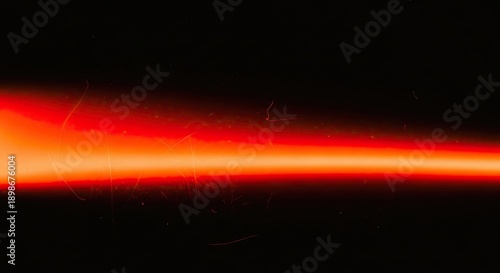 Vibrant Red Light Beam Illuminating Dark Space Abstract Background.