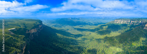 Drone aerial panoramic photograph of the Jamison Valley near the town of Wentworth Falls in the Blue Mountains in New South Wales, Australia.