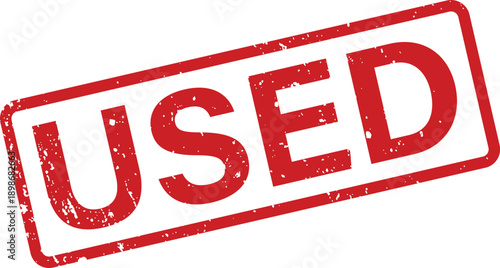 A red rectangular rubber stamp displays the clear word USED on a clean white surface