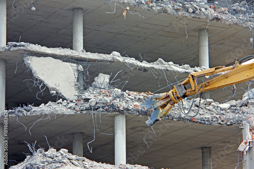 Demolition of the building with demolition excavator