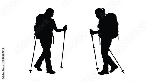 Two hikers with backpacks and poles a striking black silhouette