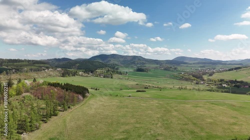 Wallpaper Mural Charming Polish Village in Mountain Region with Country Road, Green Fields, and Blue Sky Torontodigital.ca