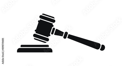 A stark black silhouette depicts a gavel resting on a sound block symbolizing justice and legal proceedings silhouette high quality