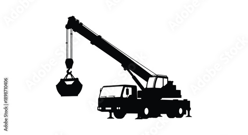 A stark black silhouette depicts a heavy duty construction crane with a gripping claw showcasing industrial power and precision silhouette