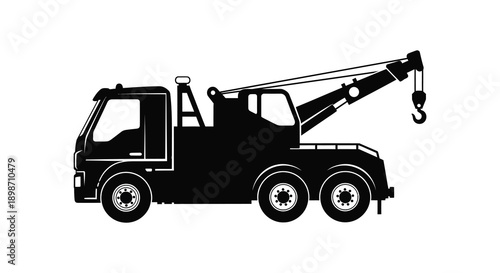A detailed black silhouette depicts a heavy duty tow truck with an extended boom and hook showcasing industrial power and rescue capabilities silhouette