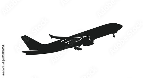 A stark black silhouette of a passenger airplane in flight against a clean white background showcasing aerial travel silhouette