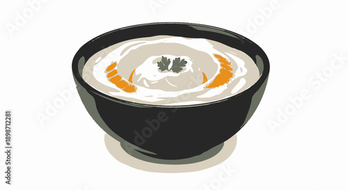 Bowl of creamy white soup with garnish and orange swirls.